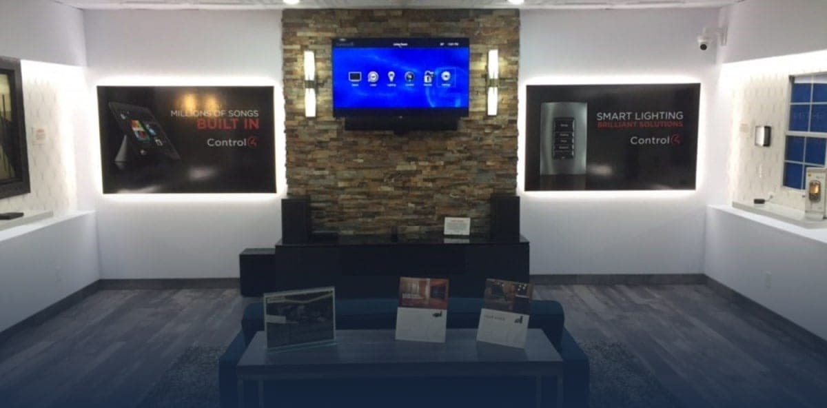 Interior of the AV & Automation Specialists Control4 Certified Showroom, showing a wall of displays