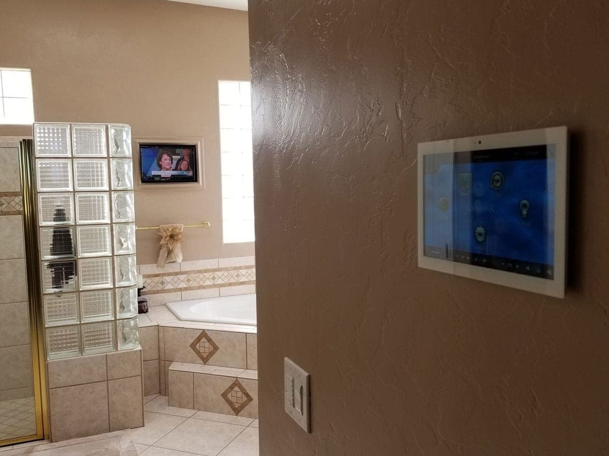 In-wall display installed beside a glass-block bath surround