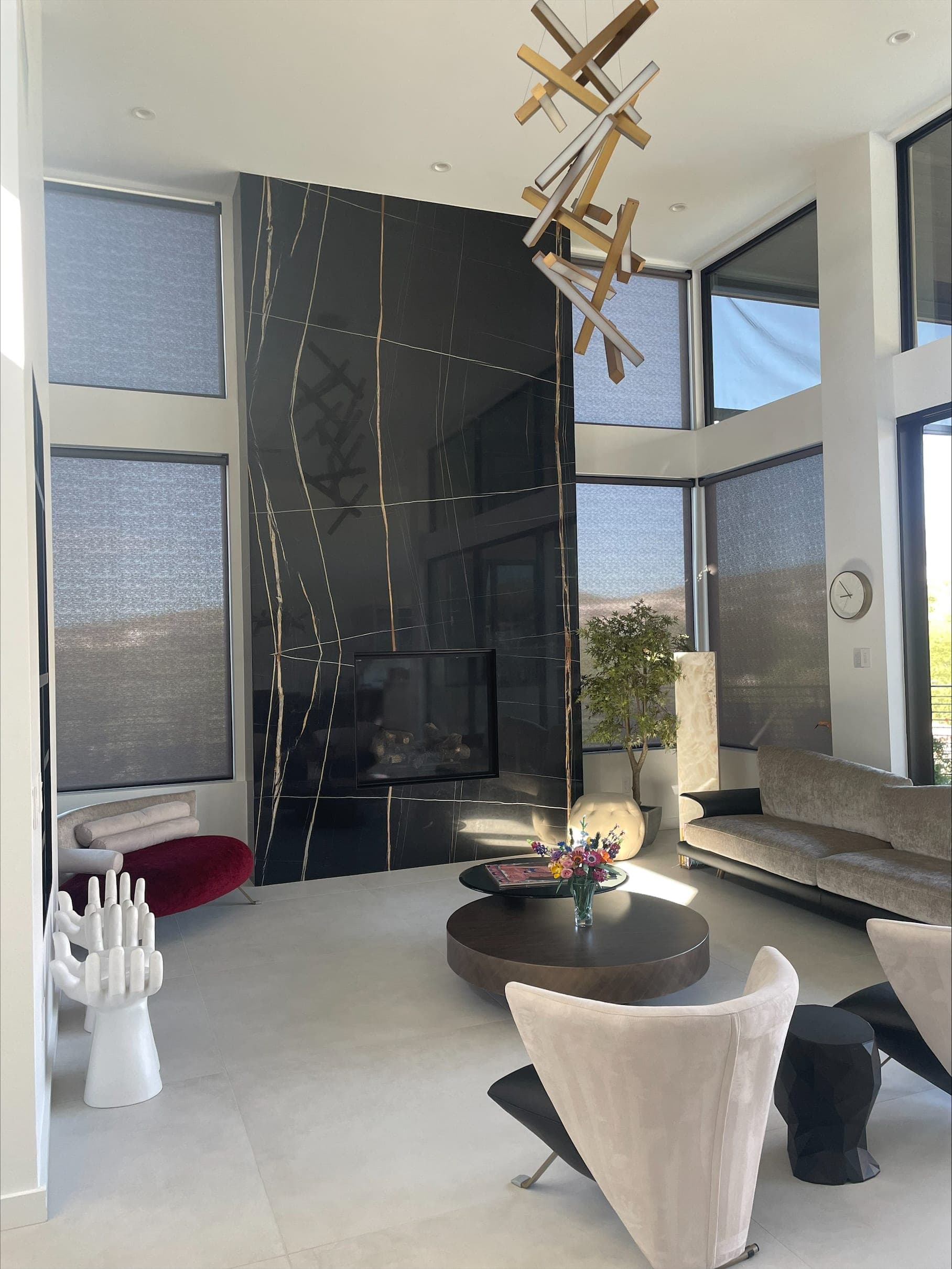 Entry lounge with a stone feature wall and concealed audio