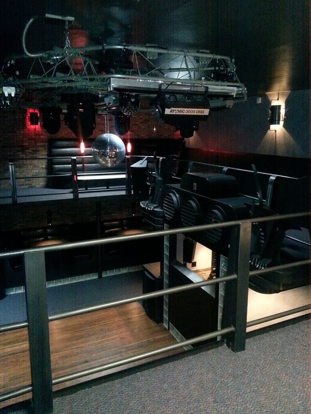 Installed AV equipment rack behind a glass enclosure