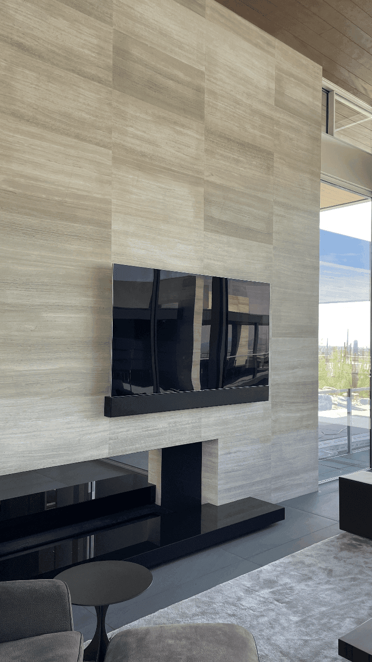 Stone-surround fireplace with an integrated display above the mantel