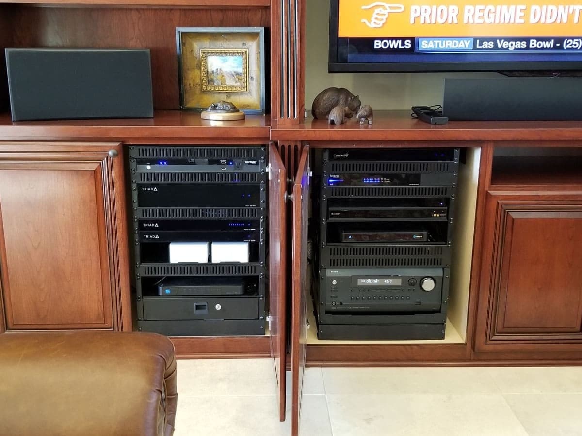 Built-in media cabinet housing AV components and cable management