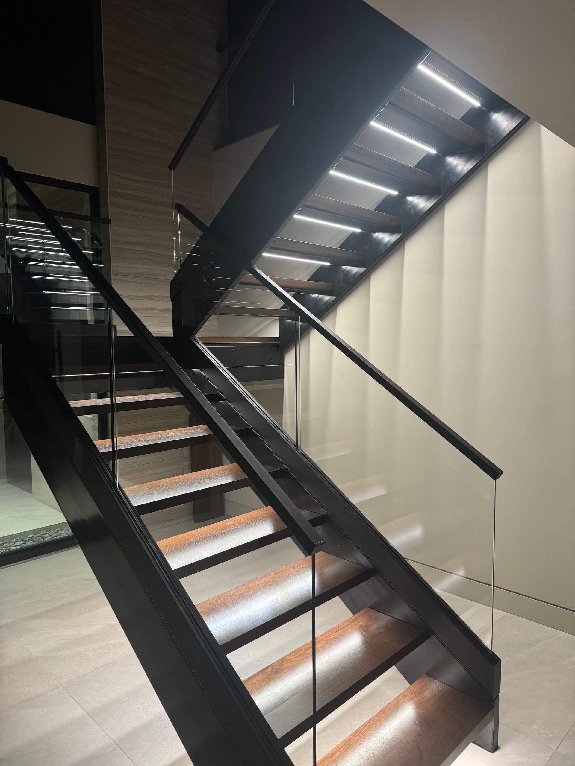Floating stairway with integrated LED step lighting